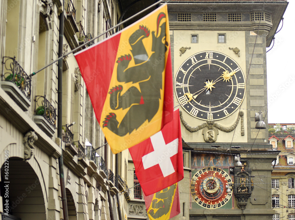 Canvas Prints swiss flag and flag of bern front of the famous clock tower in the center of the old town of bern, s