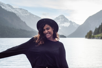 Photoshooting beautiful black swedish woman by mountain lake Tyrol