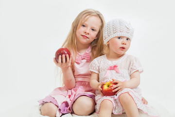 two little girls sit