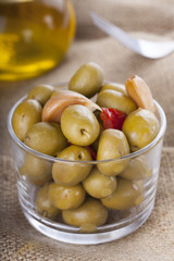 Bowl of homemade olives on a glass, typical spanish tapa