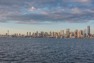 downtown seattle skyline, viewed from alki beach park at sunset. 