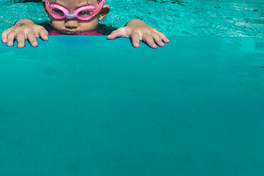 Close up of kid swimming