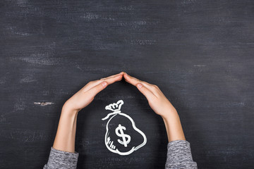 Children's hands protecting money, Business concept