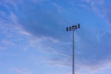 Flood light tower with blue sky