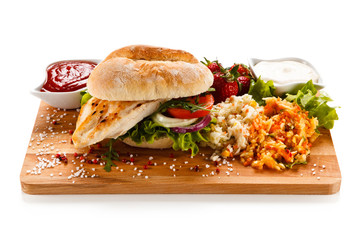 Sandwich with chicken fillet and fried egg 