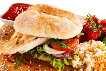 Sandwich with chicken fillet and fried egg 