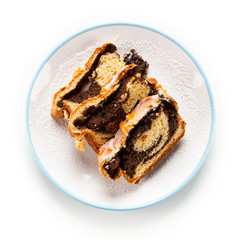 Poppy-seed cake on white background