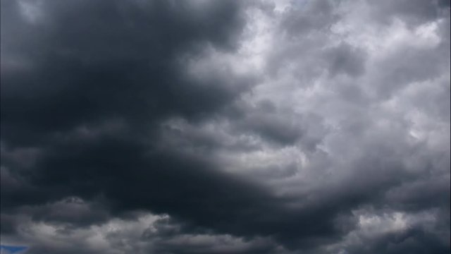 Time lapse Nature background Ominous clouds drift slowly across the sky, threatening rain. UltraHD stock footage.