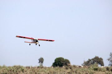 Fototapeta na wymiar A model airplane stunt plane spinning. Model: tri 60