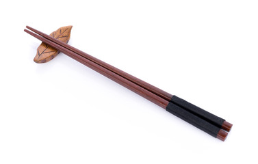 Wooden pairs of chopsticks on white background