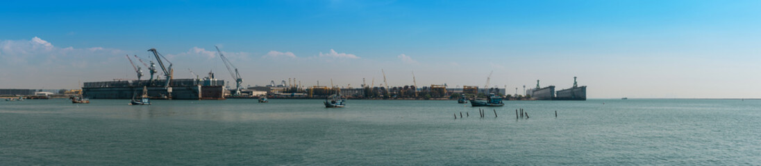 Fototapeta premium Panorama of large dry dock on sunny overcast afternoon