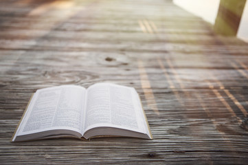 Obraz premium Bible at beach with copy space