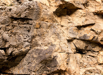 Stone cliffs in the mountains as a background