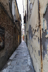Venice, Veneto / Italy- May 20, 2017: Typical narrow alley of Venice called 
