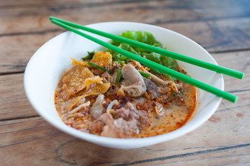 Pork Tom Yum noodle with entrails and fried dumpling