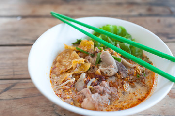 Pork Tom Yum noodle with entrails and fried dumpling