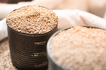white sesame seeds in gray tin can