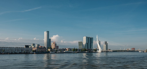 Rotterdam city cityscape skyline with Erasmus bridge and river. South Holland, Netherlands.