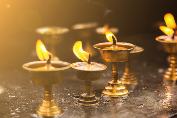 Fototapeta premium lighting a lamp for peace, Monkey temple Nepal, Monkey temple Kathmandu, Buddhist tradition, Buddhist culture