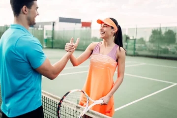Fotobehang Man and woman partners on outdoor tennis court © Nomad_Soul