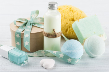 Bath accessories on white wooden table