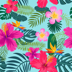 Tropical seamless pattern with palm leaves and flowers © VirinaDesign