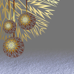 Three golden Christmas balls hanging above the snow surface