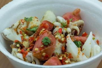 Grilled squid and sausage in foam cup