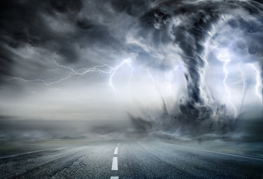 Powerful Tornado On Road In Stormy Landscape
