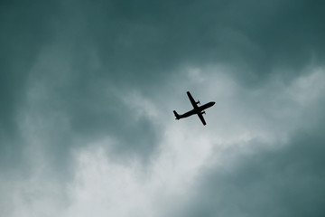 Airplane in storm clouds