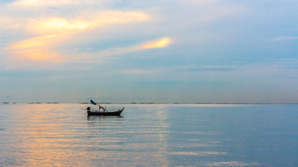 One boat in seas on evening