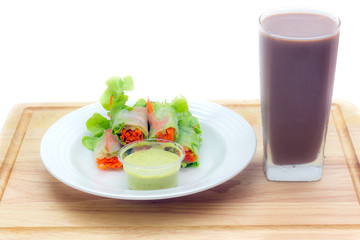 Salad vegetables with chocolate milk on wooden 