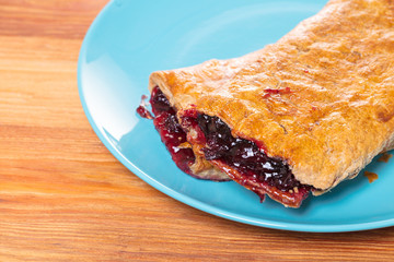 Baking, cherry strudel in a plate
