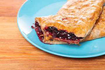 Baking, cherry strudel in a plate