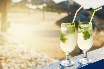 Two glasses of famous Cuban cocktail - Mojito.