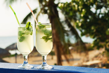 Two glasses of famous Cuban cocktail - Mojito.