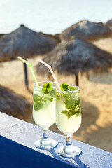 Two glasses of famous Cuban cocktail - Mojito.
