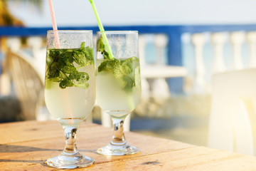 Two glasses of famous Cuban cocktail - Mojito.