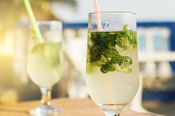 Two glasses of famous Cuban cocktail - Mojito.