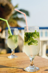 Two glasses of famous Cuban cocktail - Mojito.