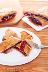 Baking, cherry strudel in a plate