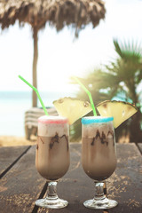 Pina colada cocktail with chocolate syrup