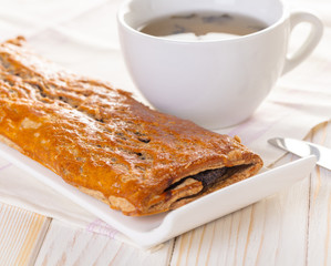 Baking strudel with poppy seeds and tea