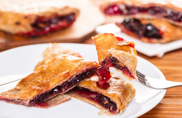 Baking, cherry strudel in a plate