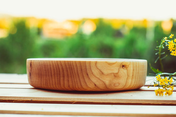 Wooden bowl in the nature