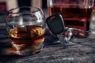 Alcohol drink,car keys and empty glass