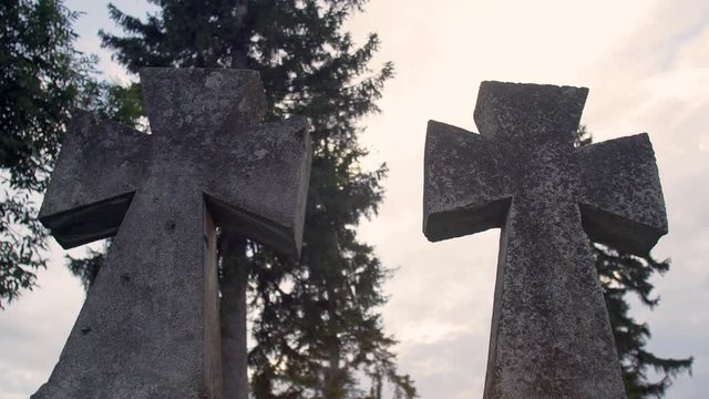 Two ancient old crosses on cemetery, 4K