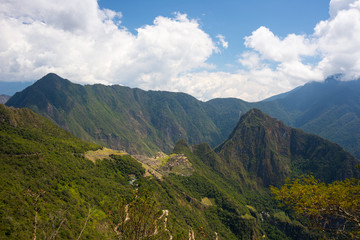 Machu Picchu archeological site and Wayna Picchu illuminated by the sunlight.