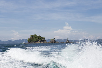 Trace tail of speed boat in the sea.