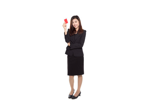 Young business woman smiling and holding red card in hand isolated on white background, smart card concept